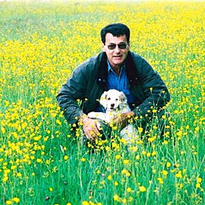 James Darley with Clumber pup in meadow